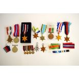 A collection of various British campaign medals, from WWI and WWII, including miniatures, some