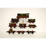 A quantity of Hornby O Gauge tin plate railway, including a clockwork tank 0405600 and rolling stock