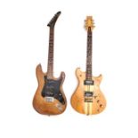 Two electric guitars, one with two pick ups, the other with three both with wooden bodies,