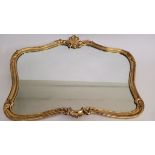 A contemporary gilt rococo style mirror, with shell pediment, 102cm x 77cm