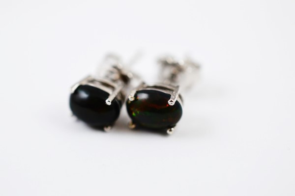 A pair of Ethiopian silver set black opal stud earrings