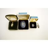 A small collection of Wedgwood Jasperware jewellery, including a silver ring, brooch, pendant, and a