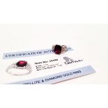 A certificated rubellite and diamond white 9ct gold dress ring, central cushion cut with faceted