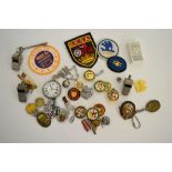 A collection of Railwayana and motor and transport badges, whistles etc, including an LMS open faced