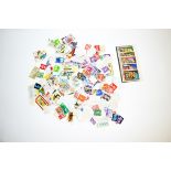 A large quantity of loose stamps, British, Commonwealth and World examples. Countries include