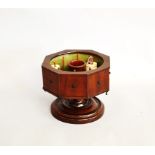 A Novelty 19th Century mahogany Rotating Cotton Reel Stand, the octagonal top with sunken well,