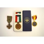A small collection of foreign medals, including a 1991 Gulf medal in plastic case, a WWI French