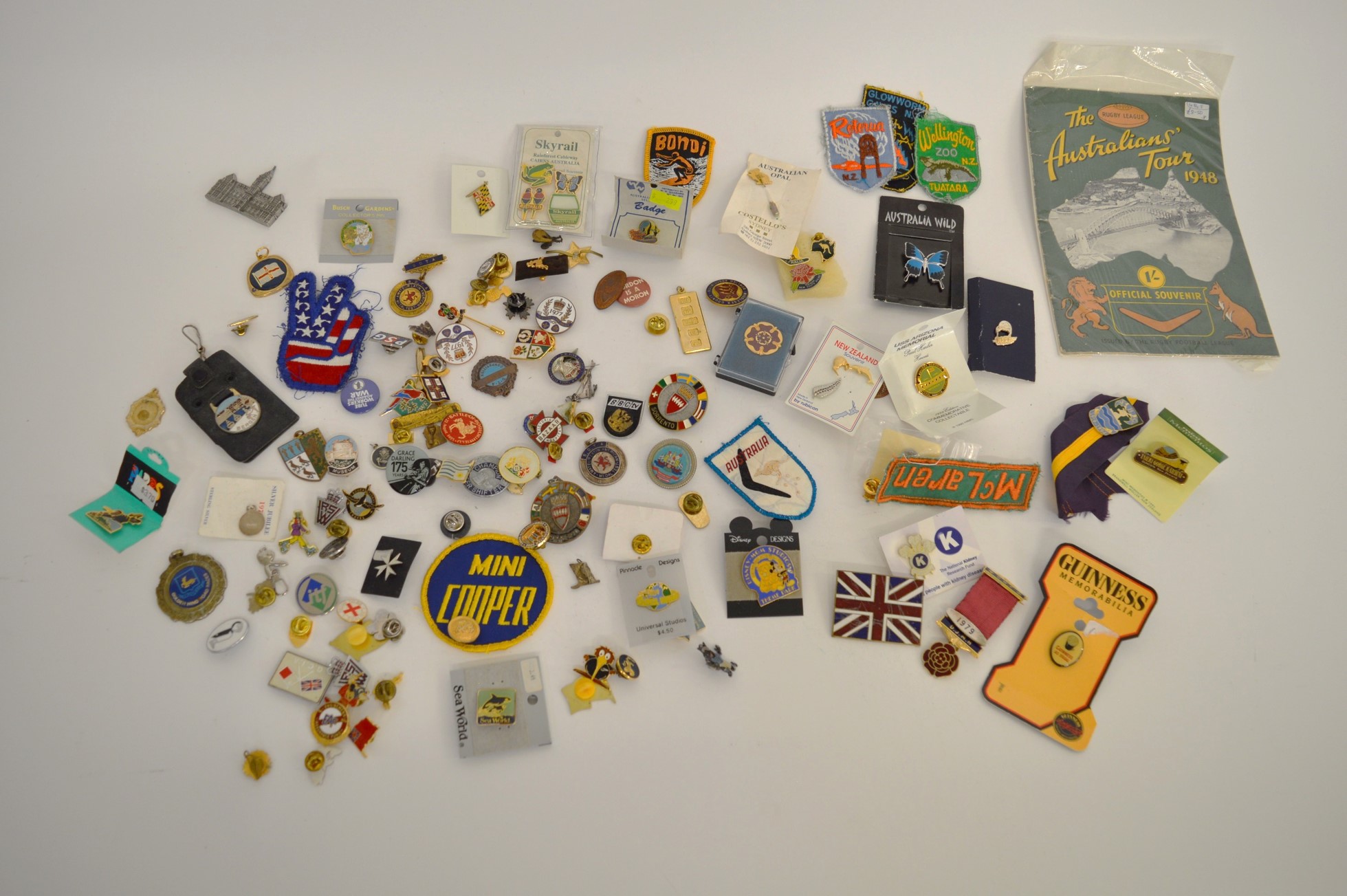 A collection of miscellaneous base metal and enamel badges, and buttons including various New