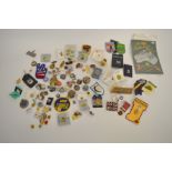 A collection of miscellaneous base metal and enamel badges, and buttons including various New