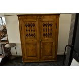 A continental waxed pine kitchen cabinet, Scandinavian, the double panel doors with stylised heart