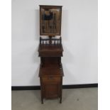 A late 19th Century mahogany gentlemans shaving stand, the top section having an adjustable bevelled