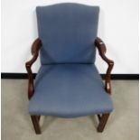 A contemporary Georgian style arm chair, upholstered in a blue fabric, raised on square reeded front