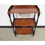 William VI mahogany three tier whatnot, gallery back, shaped shelf fronts, raised on round turned