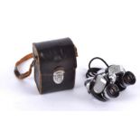 A pair of Asahi Pentax prism binoculars, no.267499 6x25, in the original black leather case