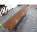 An 18th Century style mahogany oval gateleg coffin or wake table, double gate leg action with reeded