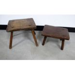 Two antique milking stool, elm seats each with four round supports (2)