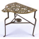 A 19th Century provincial brass and wrought iron trivet stand, the brass top with pierced