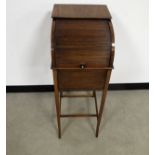 A 19th Century mahogany tambour fronted bedside cabinet, raised on elegant swept supports, 33cm x