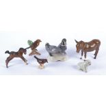 A selection of ceramic animals, comprising a Beswick donkey and pony, a British polar bear and three