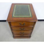 A contemporary oak filing cabinet, of two drawers, green gold tooled insert to top, 51cm 61cm x 78cm