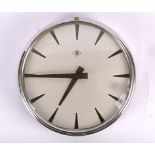 A large industrial style battery powered clock, white metal dial with hour markers in a circular