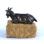 Rosalie Johnson (Contemporary British) a bronze study of a restful goat, a limited edition of