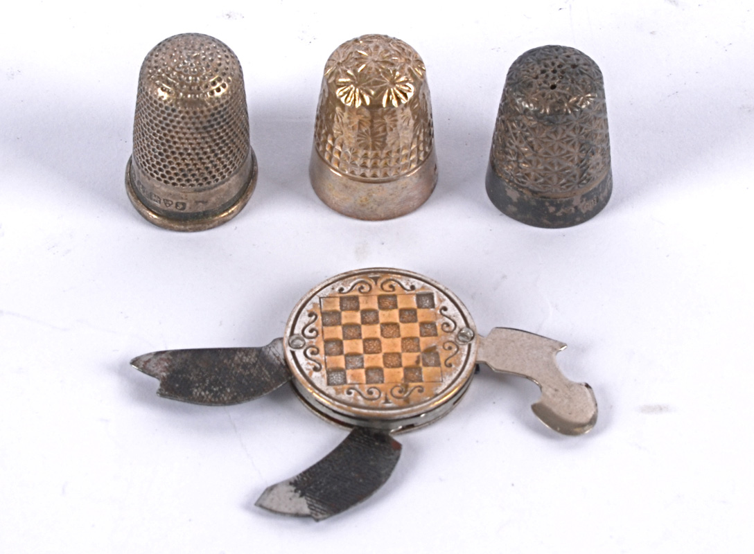 A vintage art deco manicure set in a disc, decorated with geometric patterns and motifs,