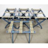 Four contemporary folding luggage stands, X frame action, floral decorated webbing, finished in