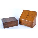 A Victorian wooden stationary box, the doors opening to reveal a fitted interior and hinged top