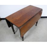 19th Century continental drop leaf table, fruitwood top, raised on round twisted supports, 51cm x