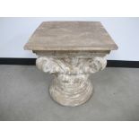 A Corinthian column capital, hand carved in soft wood with a distressed finish, top dimension 45cm x
