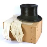 A vintage black silk top hat, retailed by Henry Heath Limited, internal dimensions 56cm, within a
