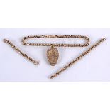 A 9ct gold chain and locket, the locket engraved with floral decoration, opening to reveal a picture