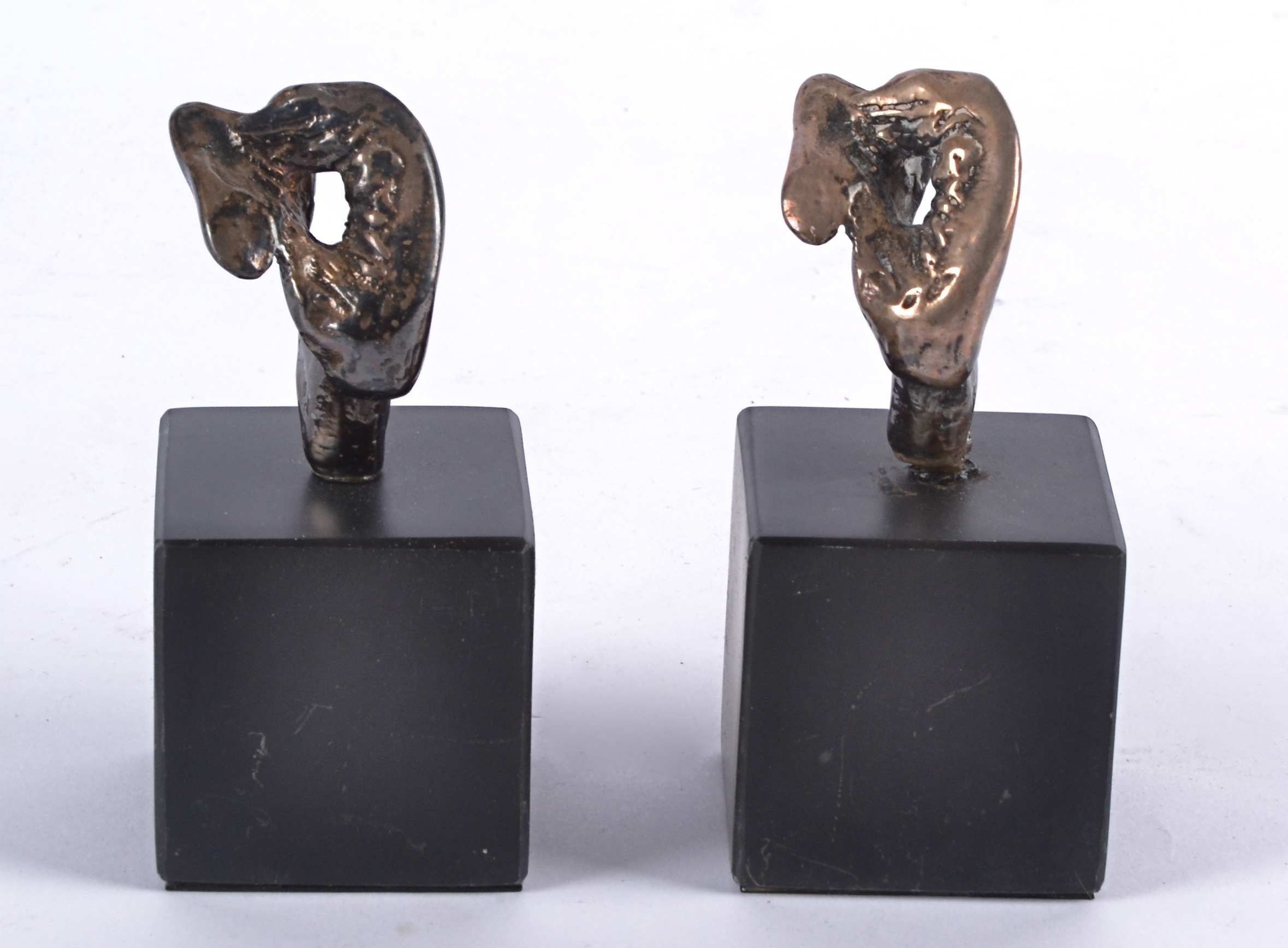 Two Eli Ilan (1928-1982) abstract silver sculptures, on black plinth bases, later recasting,