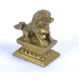A late 19th/early 20th Century Chinese brass model of the guard dog Fo, seated on a plinth, height