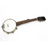 Banjo / Ukulele, a refurbished small banjo, not named, with new vellum and four strings, has