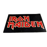 Iron Maiden display, a possible shop display sign with the iconic 'Iron Maiden' logo in red/gold