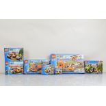 Seven boxed Lego City including Helicopter Transporter 7686 opened with manual and unchecked,