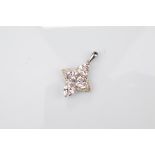 A certificated 9ct gold morganite and diamond white gold pendant, the trillion cut beryl in a