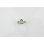 A certificated 18ct gold Siberian emerald and diamond dress ring, the oval claw set emerald with