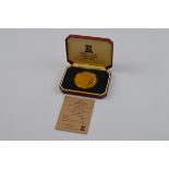 A limited edition Pobjoy Mint 22ct gold and sterling silver Earl Mountbatten crown medal, in