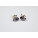 A pair of silver and blue john oval cufflinks, with worked rims and snap backs marked Sterling