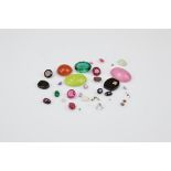 A small collection of loose gem stones, including precious opal, onyx and diamond barrel cut tablet,