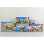 Six boxed Lego City models, Harvester Transport 60223 and Bus Stop 60154 both unopened and Pickup