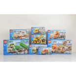 Eight boxed Lego City models, including Heavy Hauler 7998 opened with manual and unchecked,