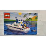 A boxed Lego Cabin Cruiser Set, 4011, opened with manual , unchecked and a box of loose lego
