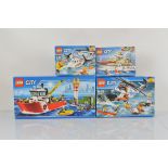 Four boxed Lego City models, including Fire Boat 60109, Heavy Duty Rescue Helicopter 60166,