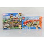 Two boxed Lego City models, including Passenger Train 7938 opened with manual and Cargo Train