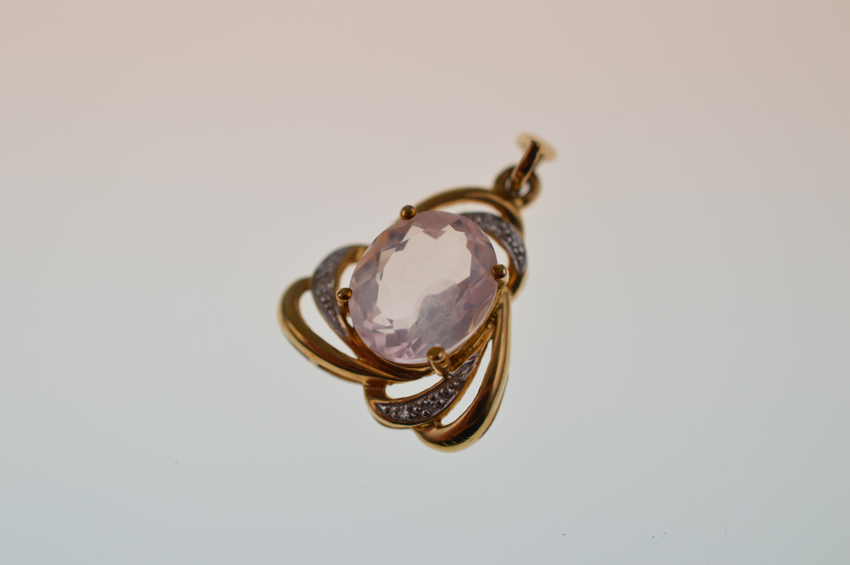 A certificated 9ct gold rose quartz and diamond pendant, the oval mixed cut claw set central stone - Image 2 of 3