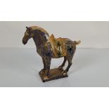 A Chinese sancai glazed horse, after the Tang with residual earth/dirt, height 20cm x 7cm wide x